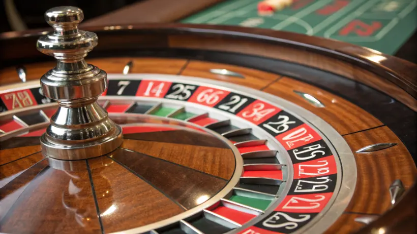 Close-up view of a roulette wheel showing numbered slots and betting layout