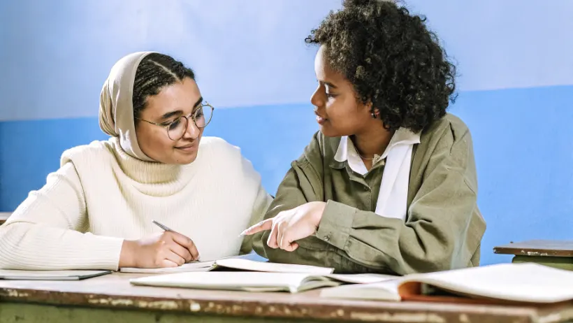 Teacher mentoring student in critical thinking and decision making